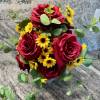 life style shot of red rose and yellow daisies
