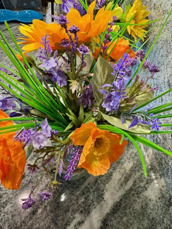 Up close orange poppies, lavender, and grass